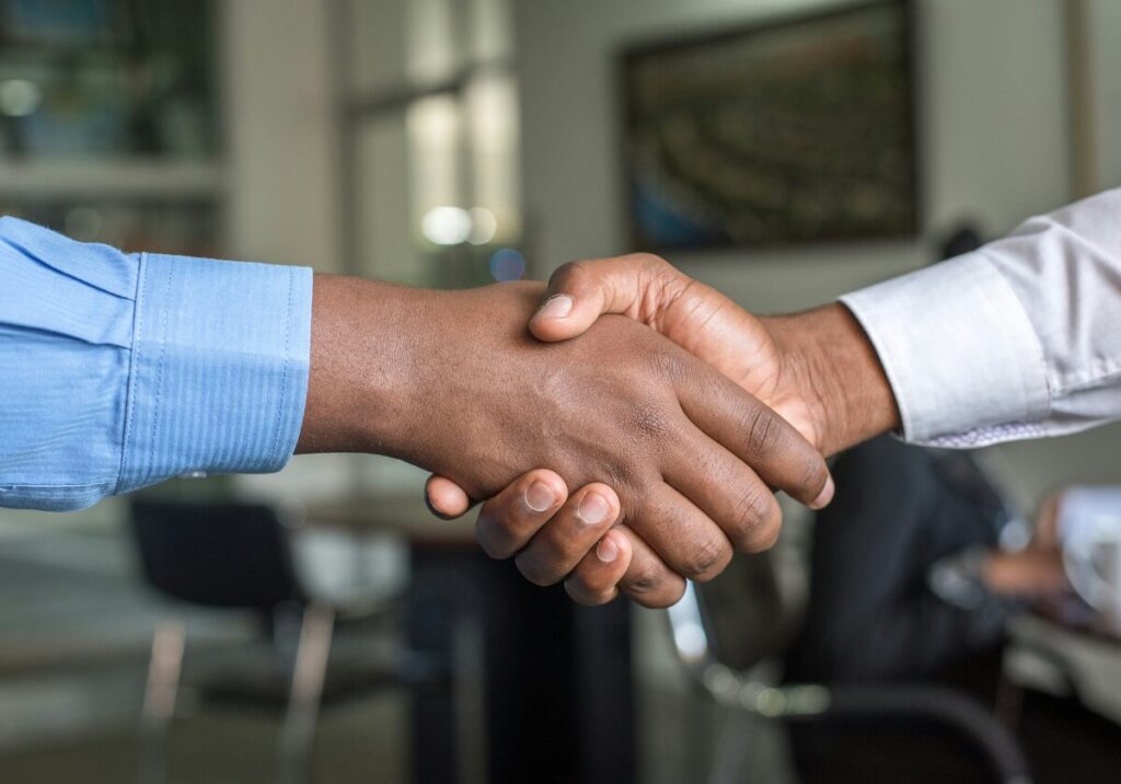 Business partnership handshake